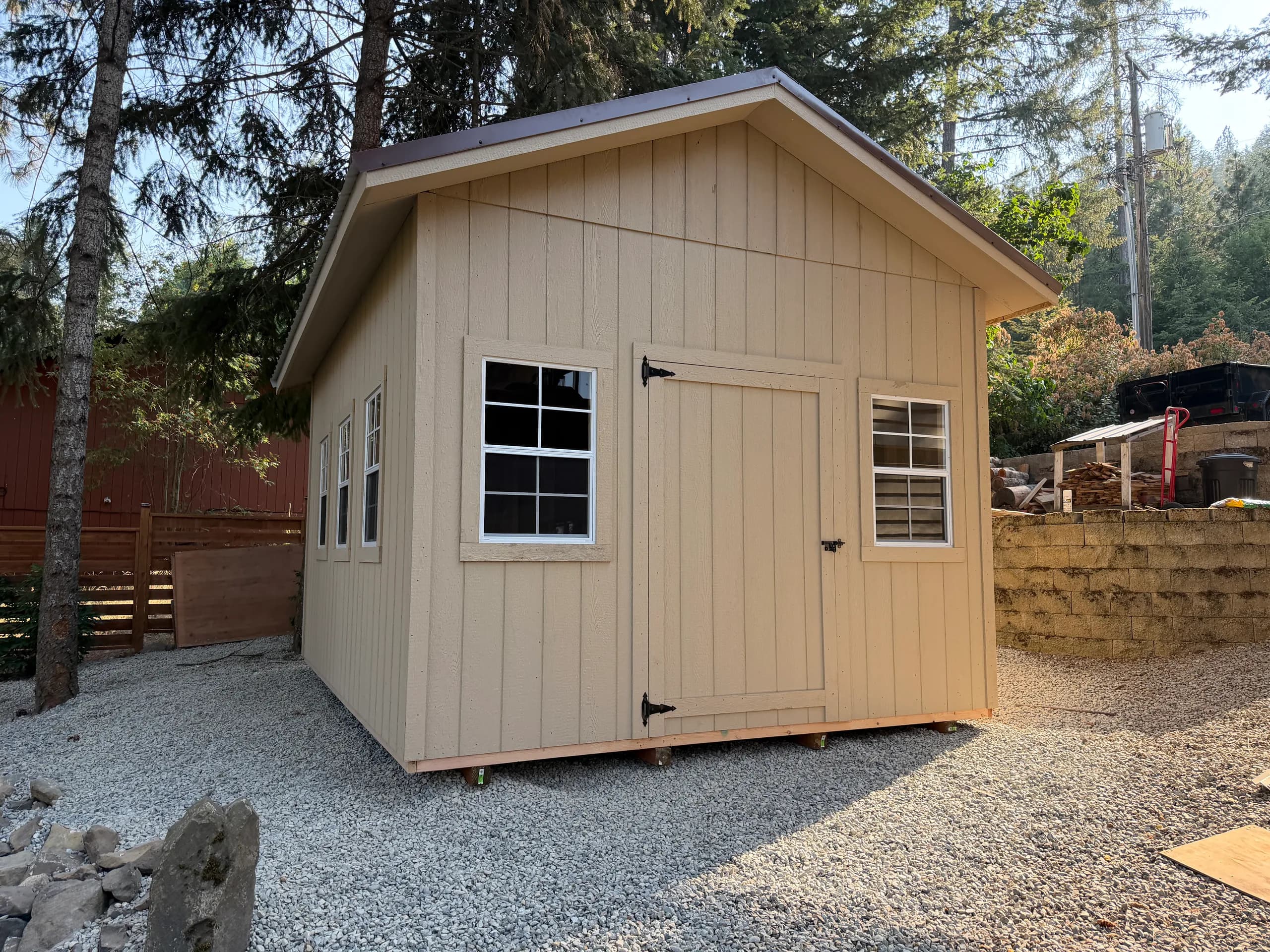 luxe gable storage shed with golden hour lighting