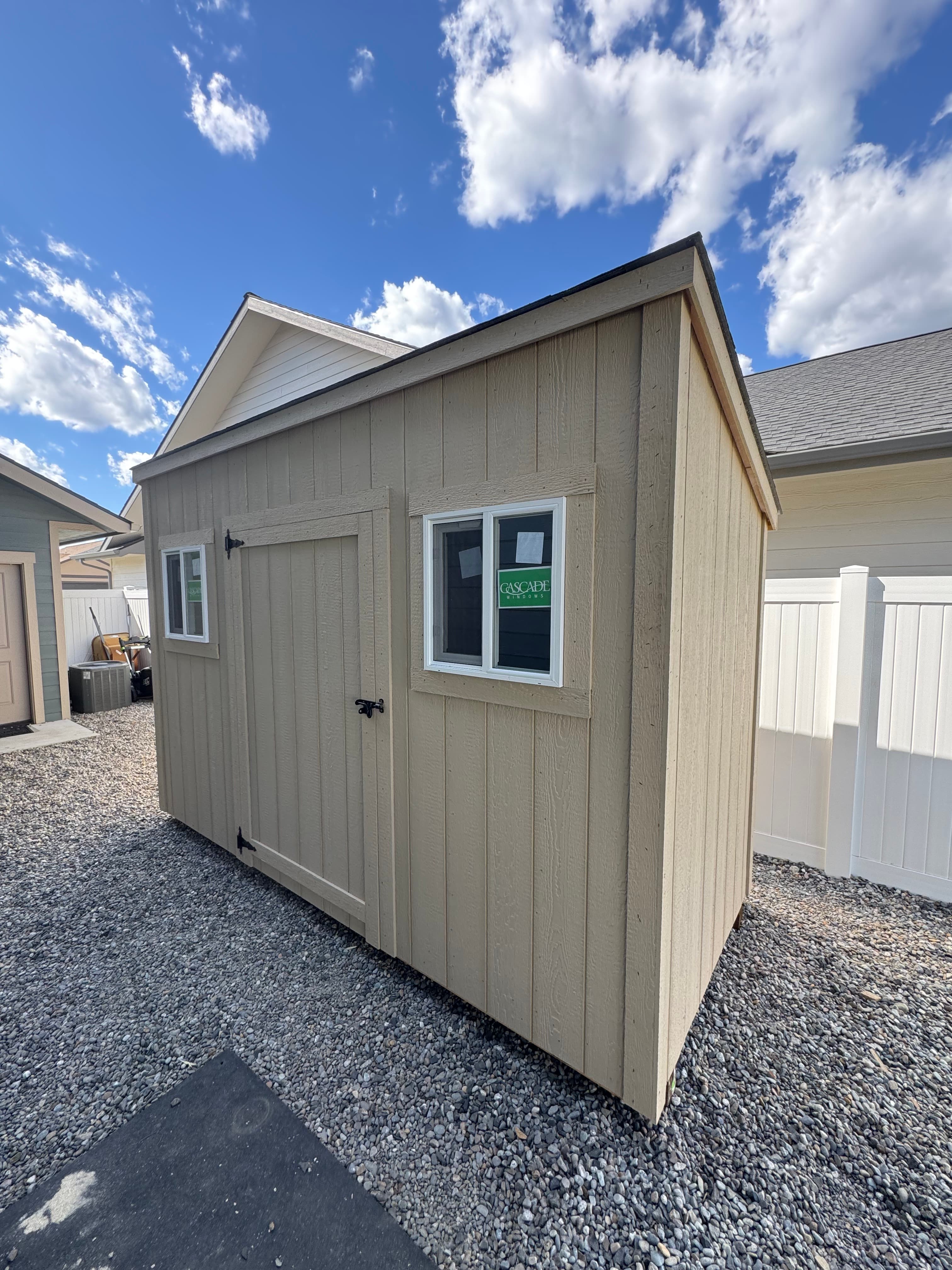5x12 Mini Modern Shed with door and two windows in a narrow gravel side yard