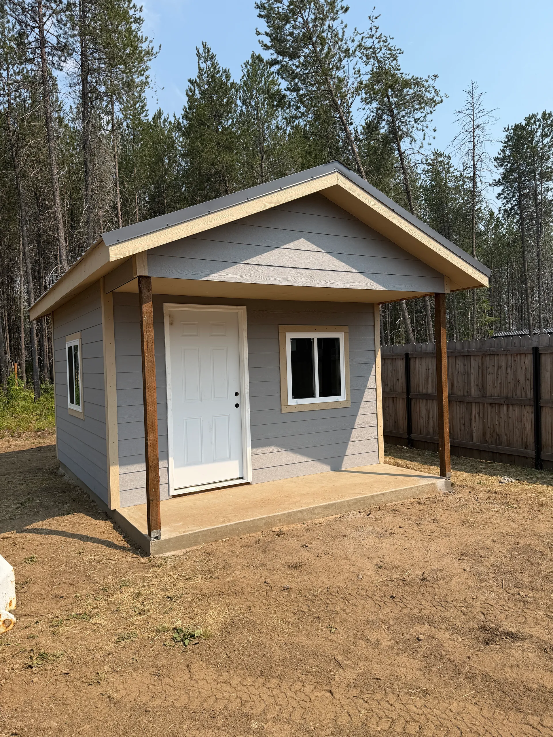 office shed front view with concrete slab, lap siding, 12x16 size and metal roof