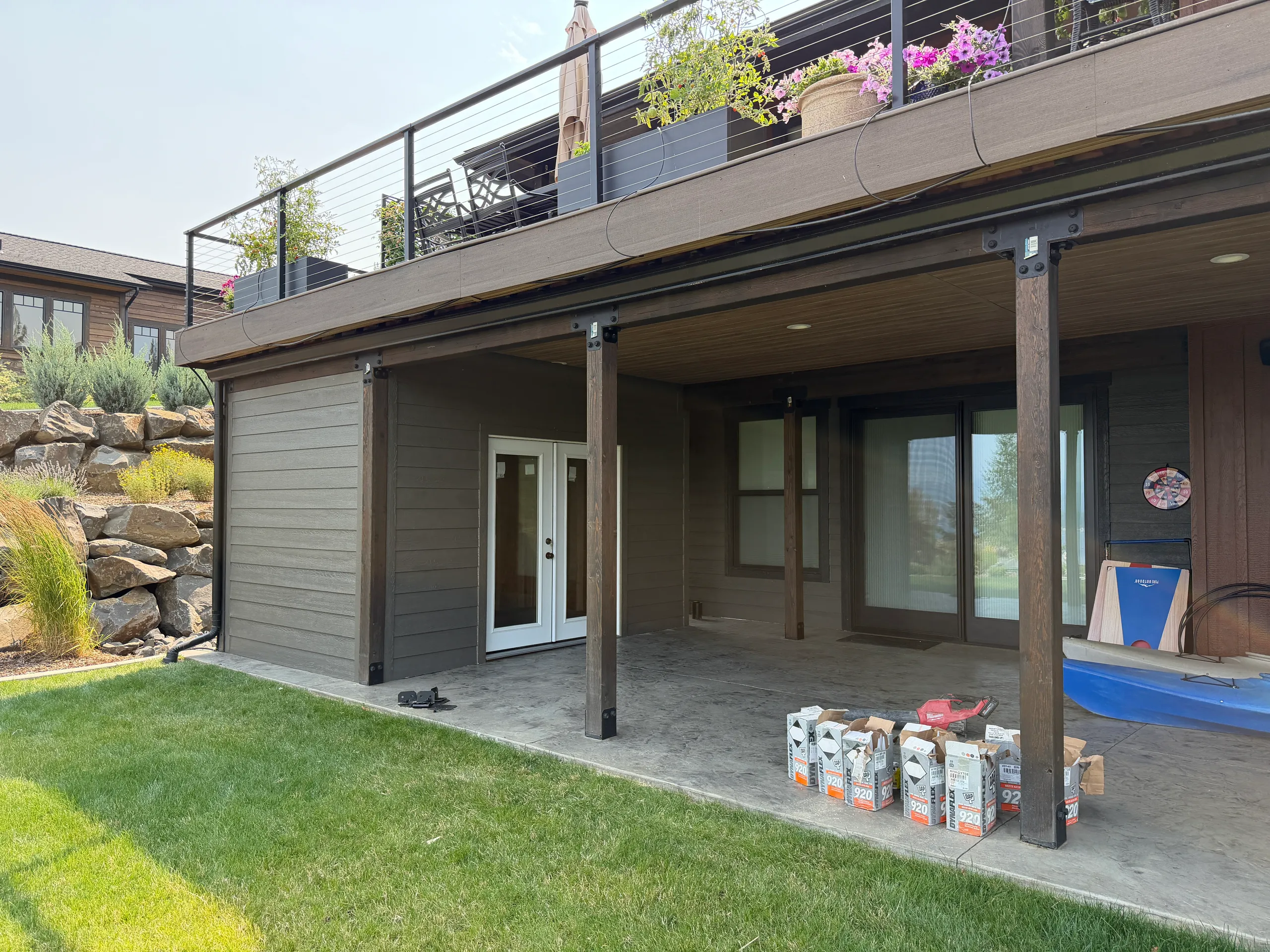 Custom built shed integrated into deck with siding to match house